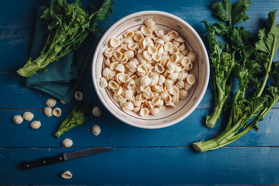 High angle view of chopped vegetables in bowl on table