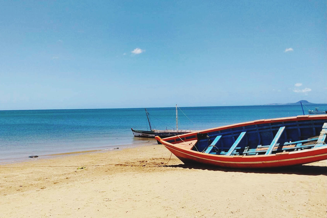 Water Sea Beach Land Sky Nautical Vessel Sand Horizon Over Water Transportation Nature Horizon Scenics - Nature Mode Of Transportation Long-tail Boat Tranquility Beauty In Nature Vehicle No People Travel Tranquil Scene