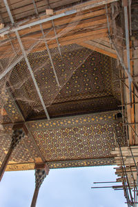 Low angle view of roof of building against sky