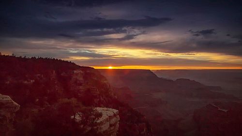 Scenic view of sea against sky at sunset