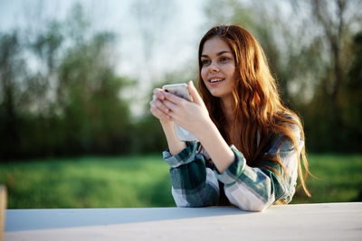 Young woman using mobile phone