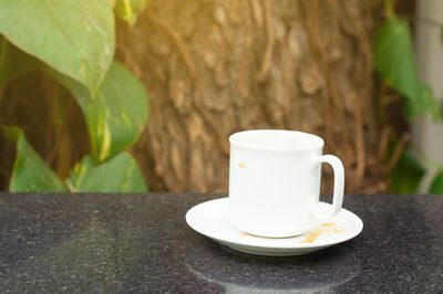 Close-up of coffee cup on table