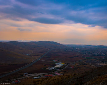 Aerial view of landscape against sky during sunset