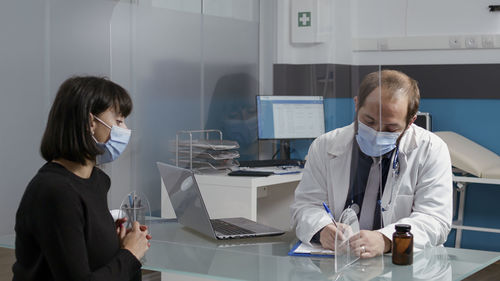 Female doctor working at clinic