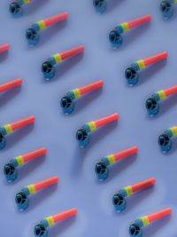 High angle view of colored pencils on white background