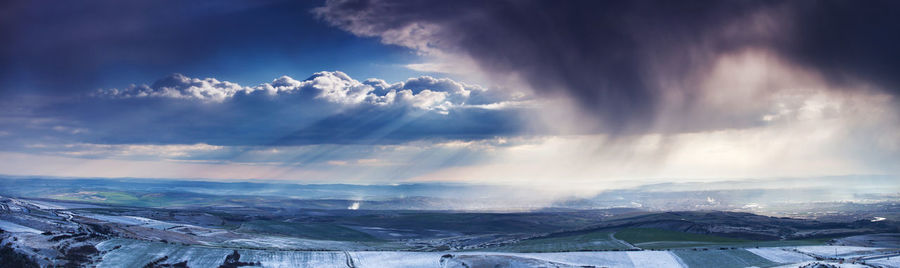 Scenic view of snow mountains against sky