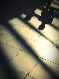 High angle view of shadow on floor