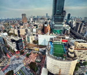 High angle view of modern buildings in city against sky