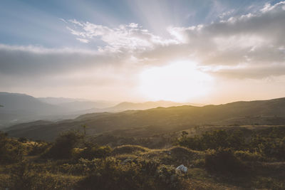 Scenic view of landscape against sky during sunset