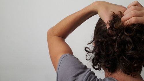 Rear view of woman against white background