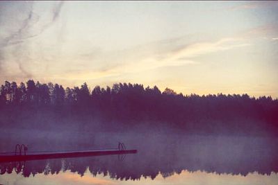 Scenic view of lake at sunset