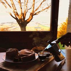 Close-up of food on table against window