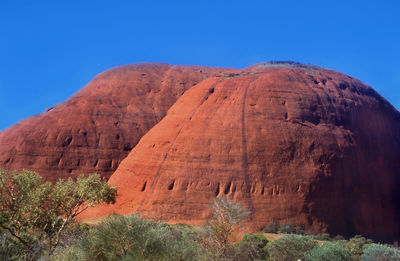 View of rock formations against blue sky