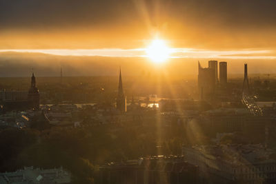 View of the skyline of riga from above late afternoon with warm light