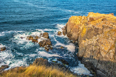 High angle view of rocks in sea