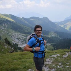 Portrait of young man standing on mountain