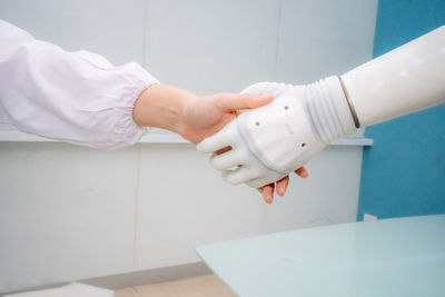 Cropped hand of man holding equipment