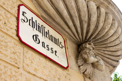 Low angle view of text on wall