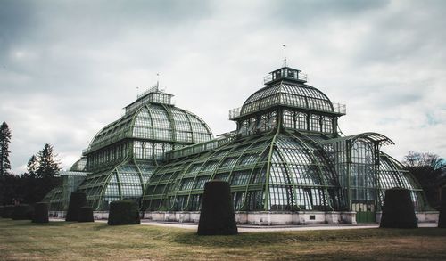 Low angle view of historical building against cloudy sky