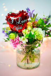 Close-up of flowers on glass table