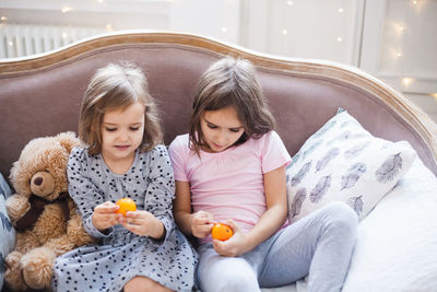 Cute girl sitting with toy