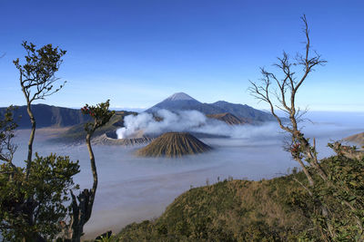 Scenic view of volcanic mountain against sky