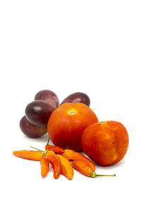 Close-up of oranges against white background