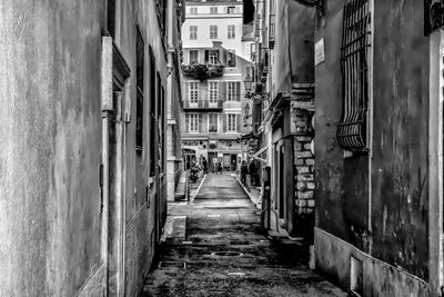 Narrow alley amidst buildings in city