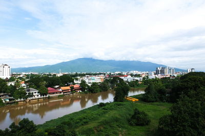 Scenic view of townscape by buildings against sky