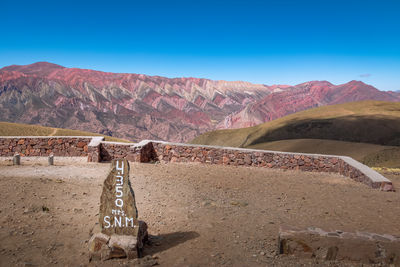 Scenic view of mountains against clear blue sky