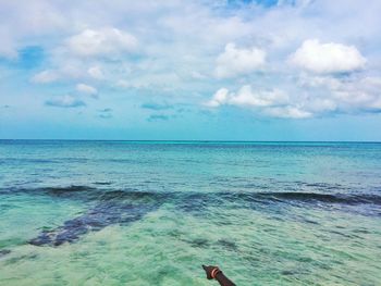 Scenic view of sea against cloudy sky