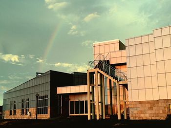 Low angle view of building against cloudy sky