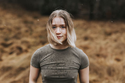 Smiling young woman looking at camera