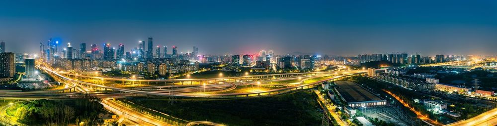 High angle view of illuminated buildings in city at night