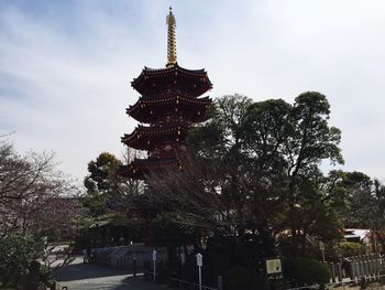 Low angle view of statue against sky