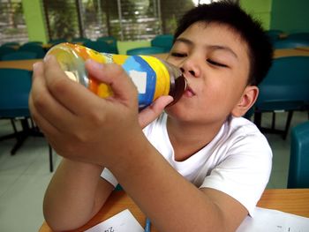 Close-up of boy sitting