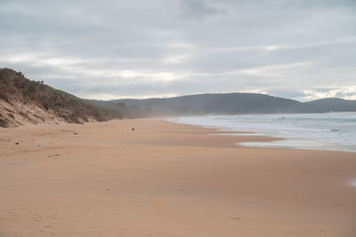Scenic view of beach against sky