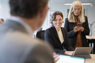 Businesswomen talking in office