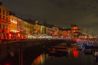 Illuminated buildings in city at night