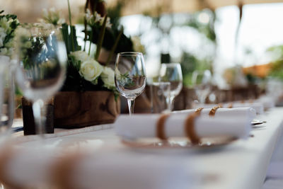 Luxury table settings for fine dining with and glassware, pouring wine to glass. 