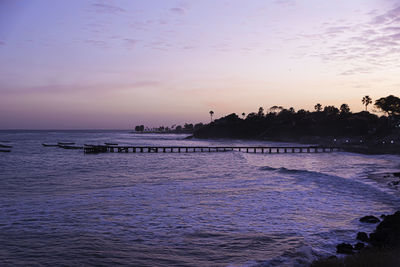 Scenic view of sea against sky at sunset