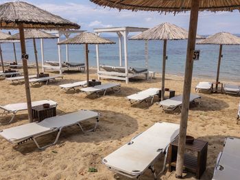 Lounge chairs and parasols on beach