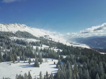 Scenic view of snowcapped mountains against sky
