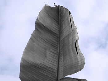 Low angle view of statue against cloudy sky