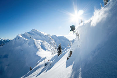 Skier captured mi air while backcountry heli skiing in the kootenays, kaslo, b.c.