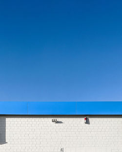 Low angle view of building against blue sky