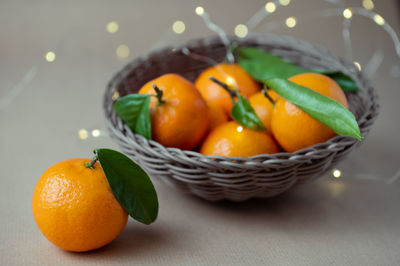 Close-up of fruits in basket on table