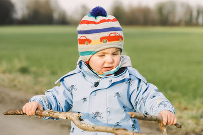 Full length of cute baby girl on snowy field