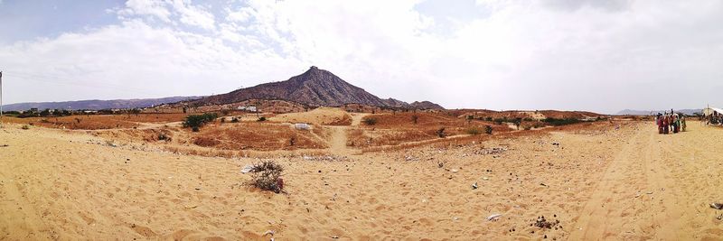 Panoramic view of desert against sky