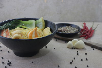 Close-up of fruits in bowl on table